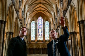 Canon treasurer being shown around Salisbury Cathedral.