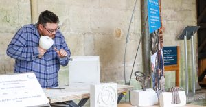 Man chiselling a stone