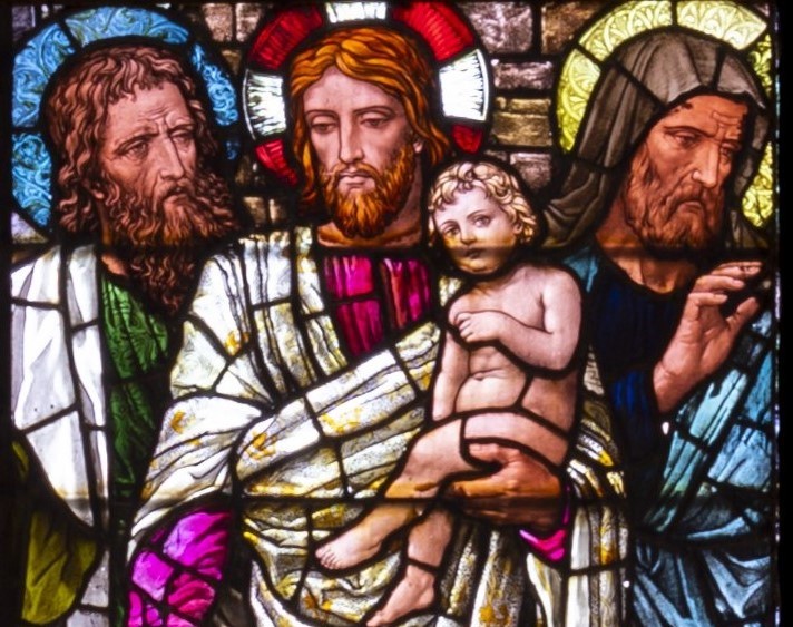 Image of part of the stained glass window found in the nave of the Cathedral, showing Jesus surrounded by children.