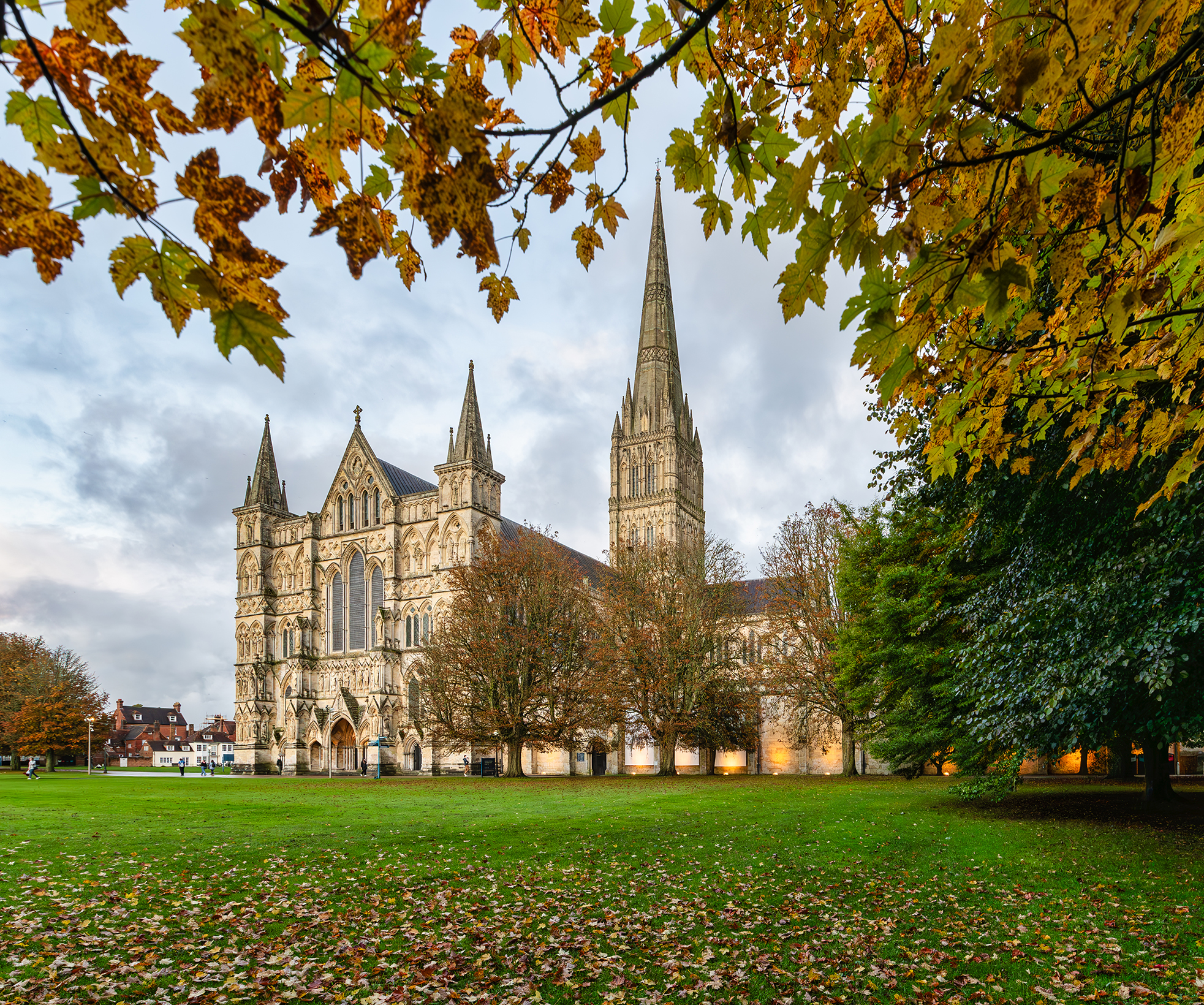 View of cathedral across west lawn, framed by autumnal trees