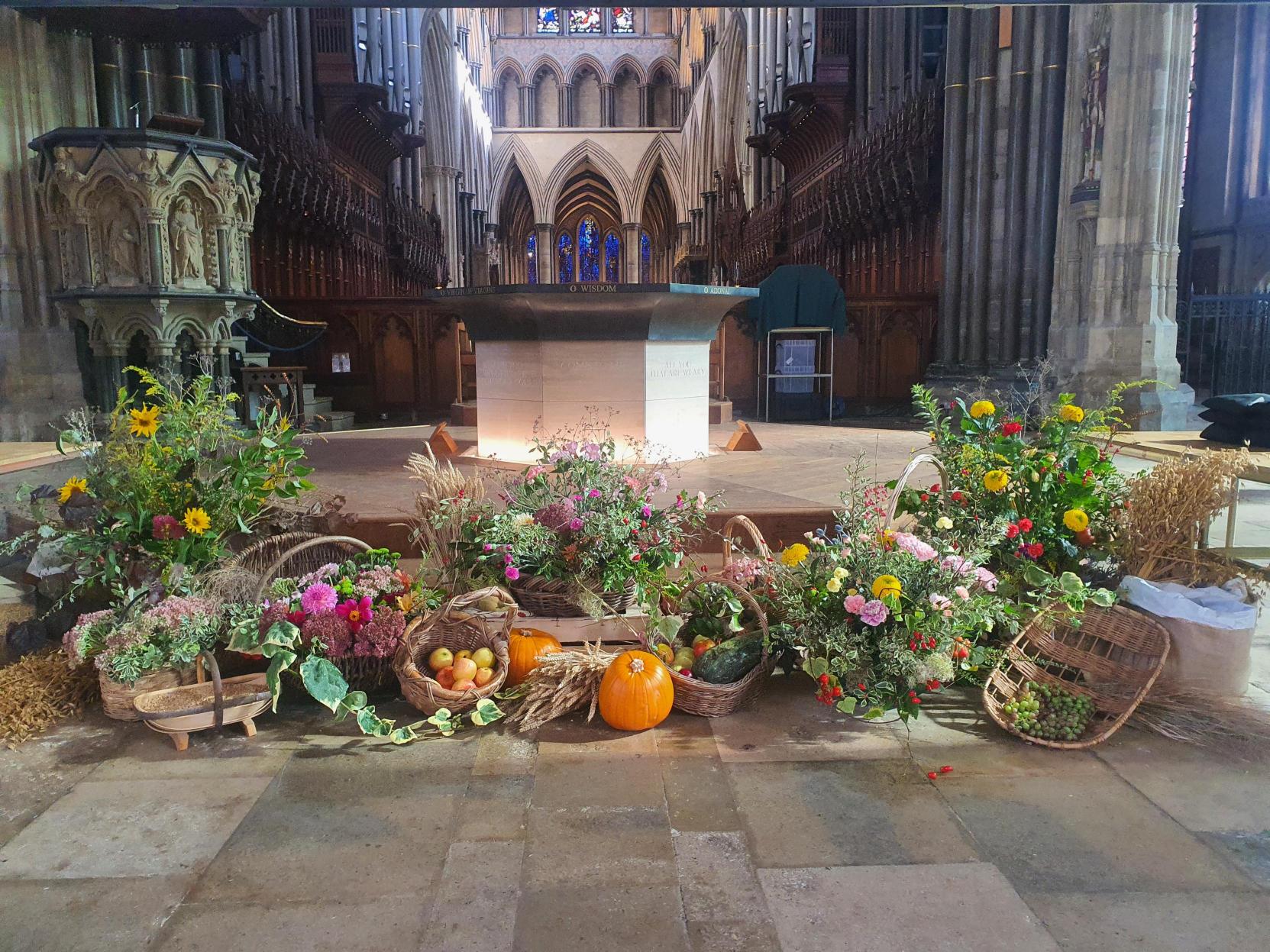 A display of flowers and vegetables in from the of the altar in the nave crossing