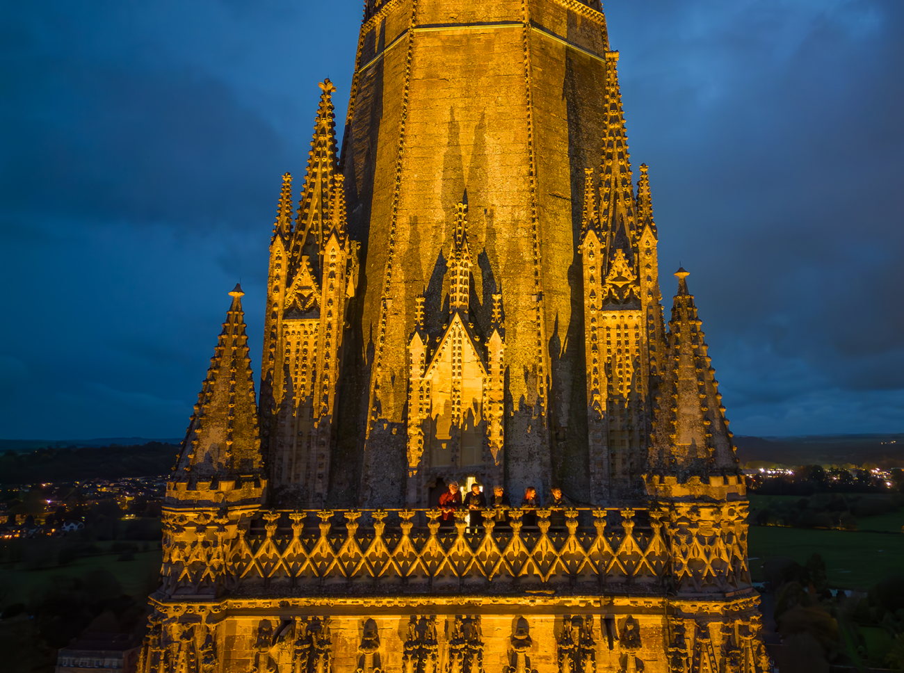 The Cathedral tower balcony after dark with a group of visitors